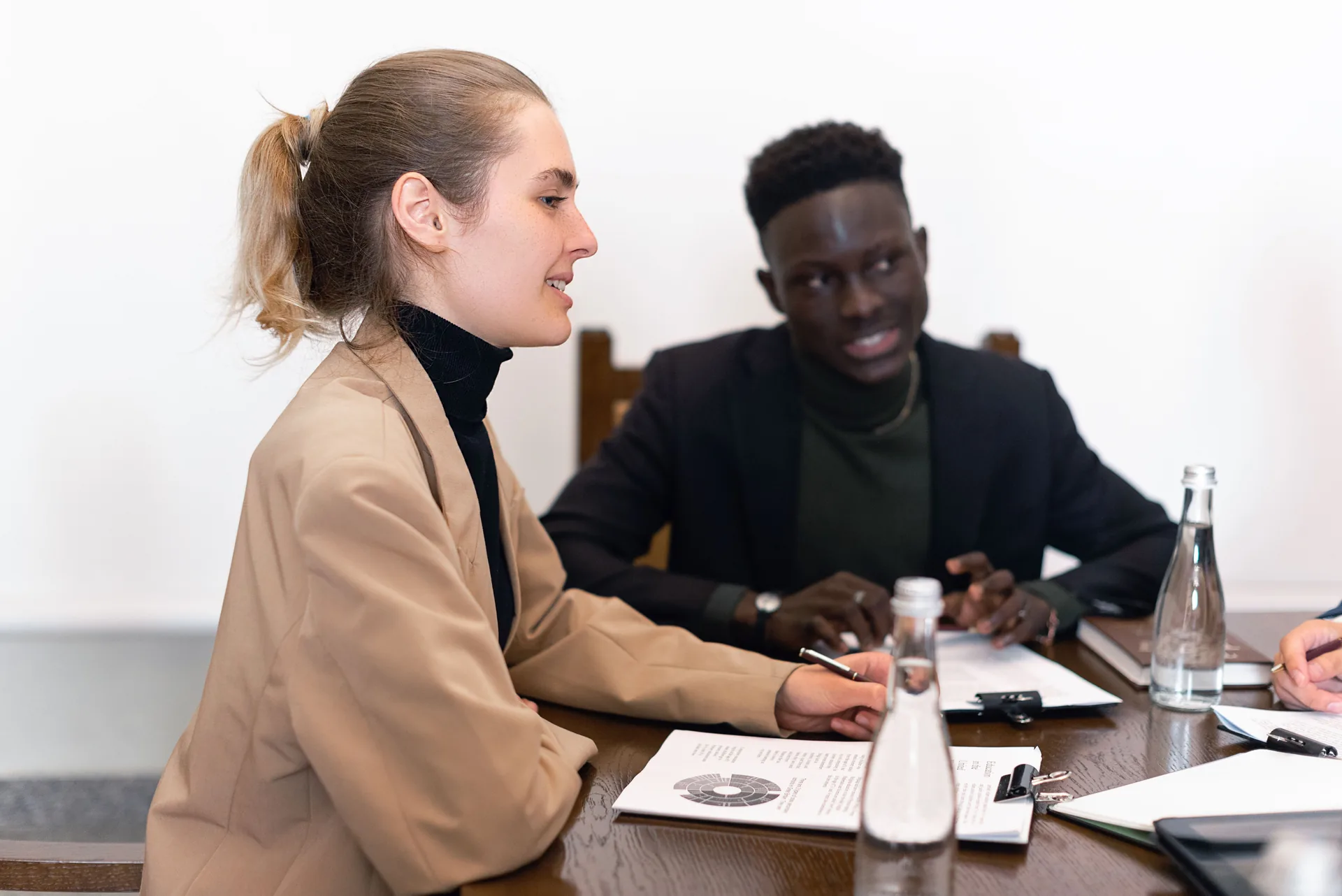 Professionals reviewing documents during a business consultation